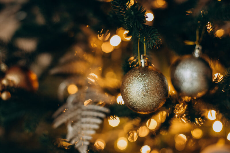 holiday decorations hanging on a christmas tree