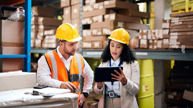 Warehouse, tablet and people teamwork for storage, inventory and supply chain management for b2b distribution. Factory, Industry partner or worker on digital technology, software and logistics boxes