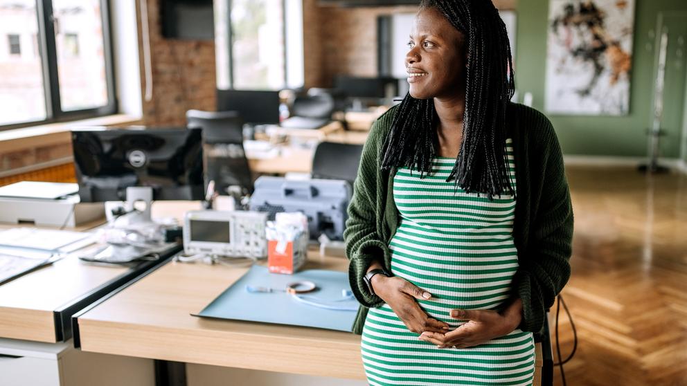 Portrait of pregnant woman in the office