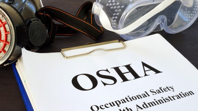 Pile of documents with Occupational Safety and Health Administration OSHA.