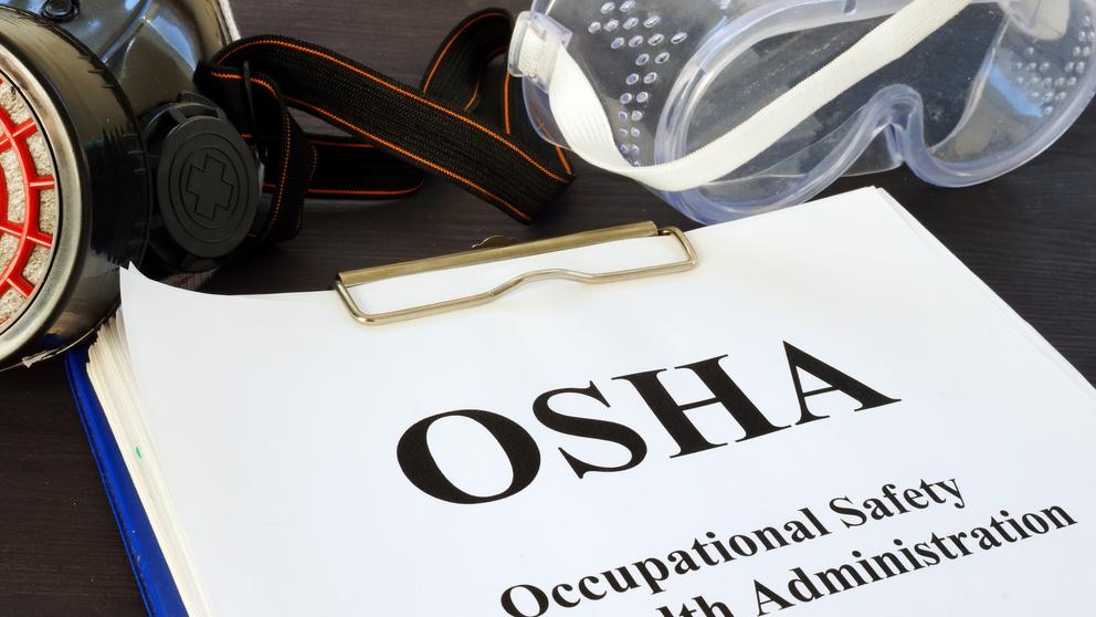 Pile of documents with Occupational Safety and Health Administration OSHA.