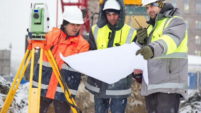 Civil Engineers At Construction Site In Winter Season