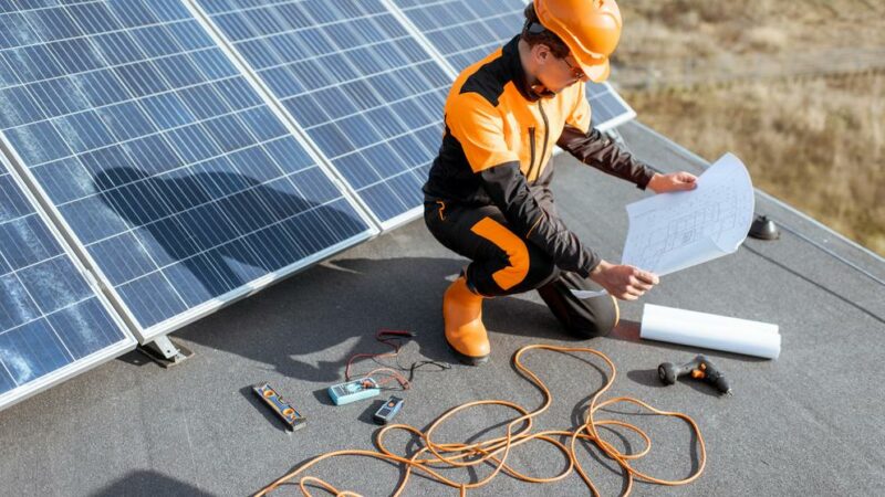 Electrician installing solar panels