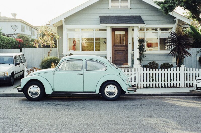vw beetle in front of house