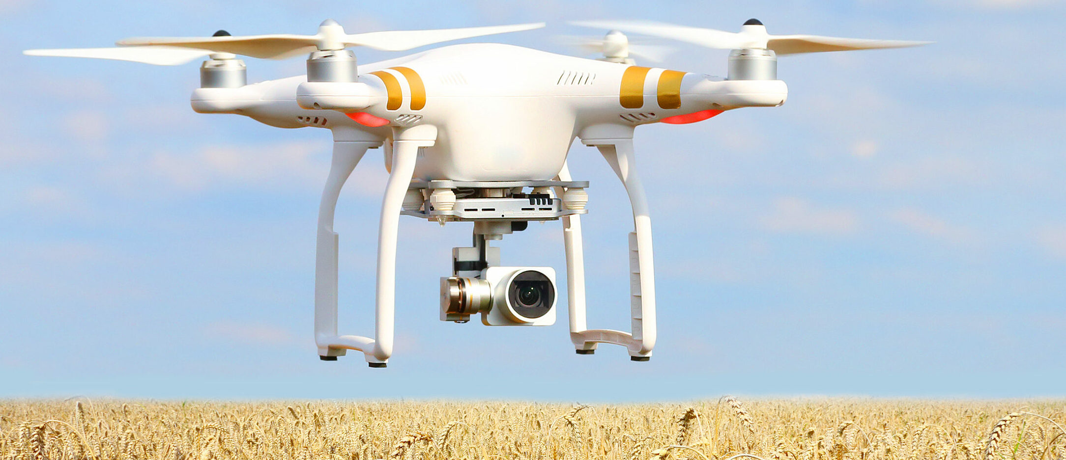 Drone quadrocopter with camera. New tool for farmers use drones to inspect of cultivated fields. Modern technology in agriculture.