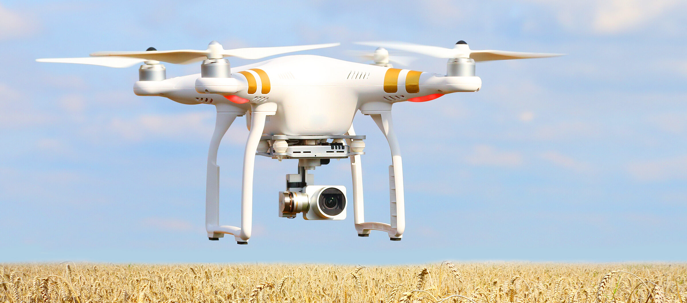 Drone quadrocopter with camera. New tool for farmers use drones to inspect of cultivated fields. Modern technology in agriculture.